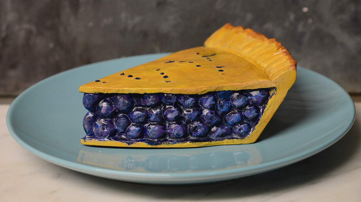 photo of wood artwork that looks like blueberry pie