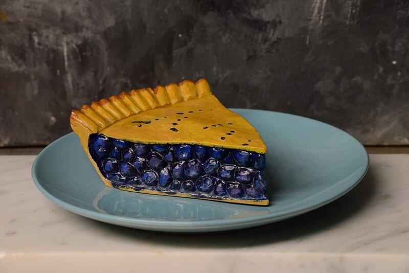photo of wood artwork that looks like blueberry pie
